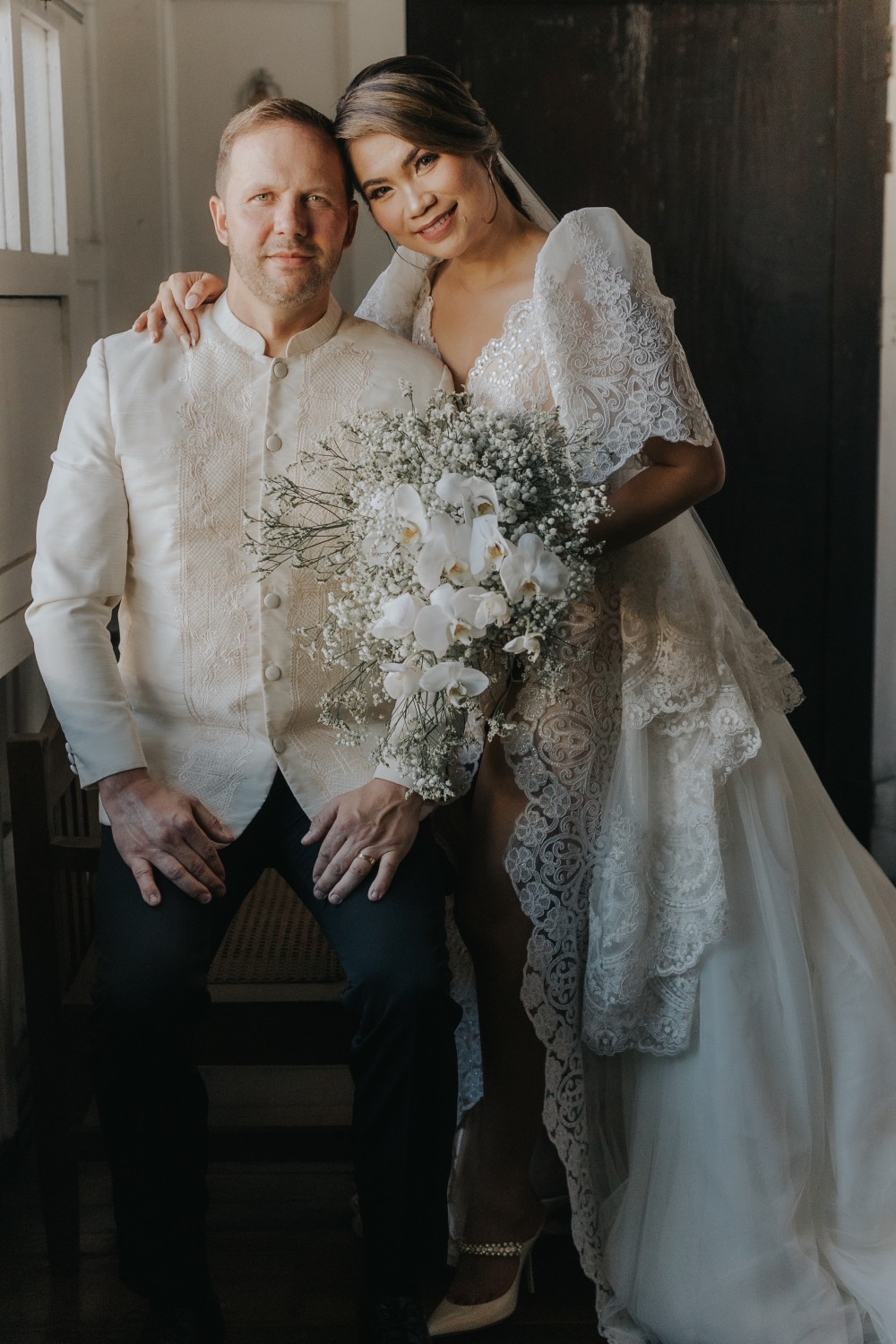 Wedding couple in traditional Barong Tagalog and Filipiniana bridal gown by Josip Tumapa Design