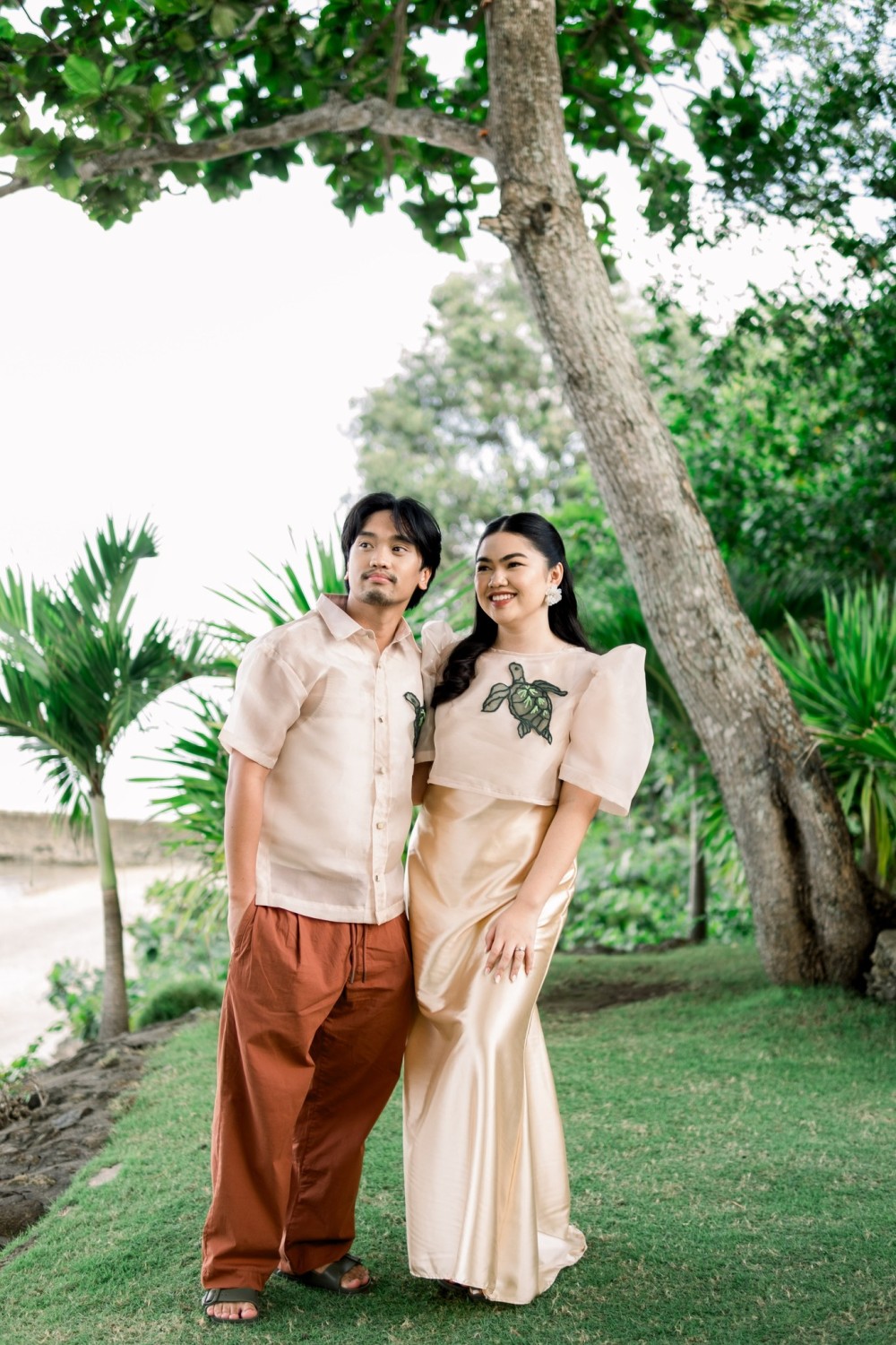 Couple in modern Filipiniana and Barong with embroidered turtle design by Josip Tumapa Design